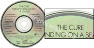 Standing on a beach � The singles (issued 1992). Title is "Standing..." instead of "Staring...". Data logo on disc. There is text around half of the outer circle. - Thanks to rafacure